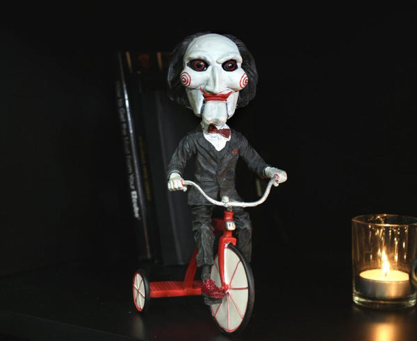 Saw: Billy the Puppet on Tricycle Head Knocker